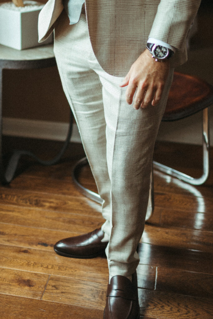 groom in khaki beige plaid suit with brown shoes
