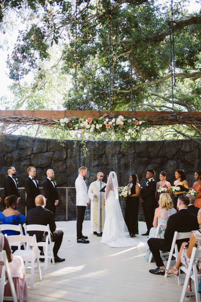 stylish and timeless wedding ceremony at Calamigos Ranch in front of waterfall 
